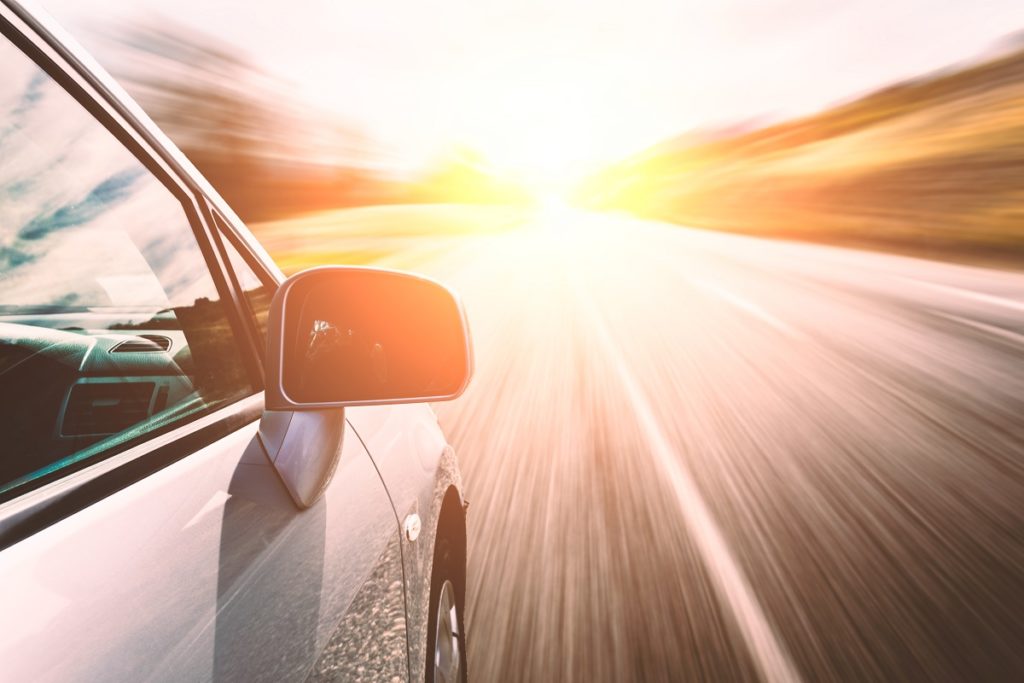 Car ride on road in sunny weather